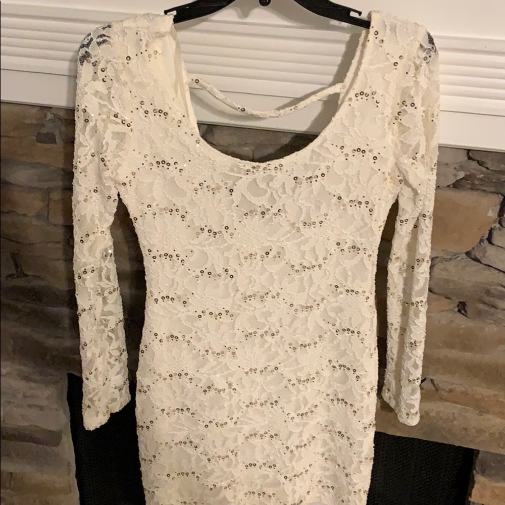 Short white, sequined dress with sheer sleeves